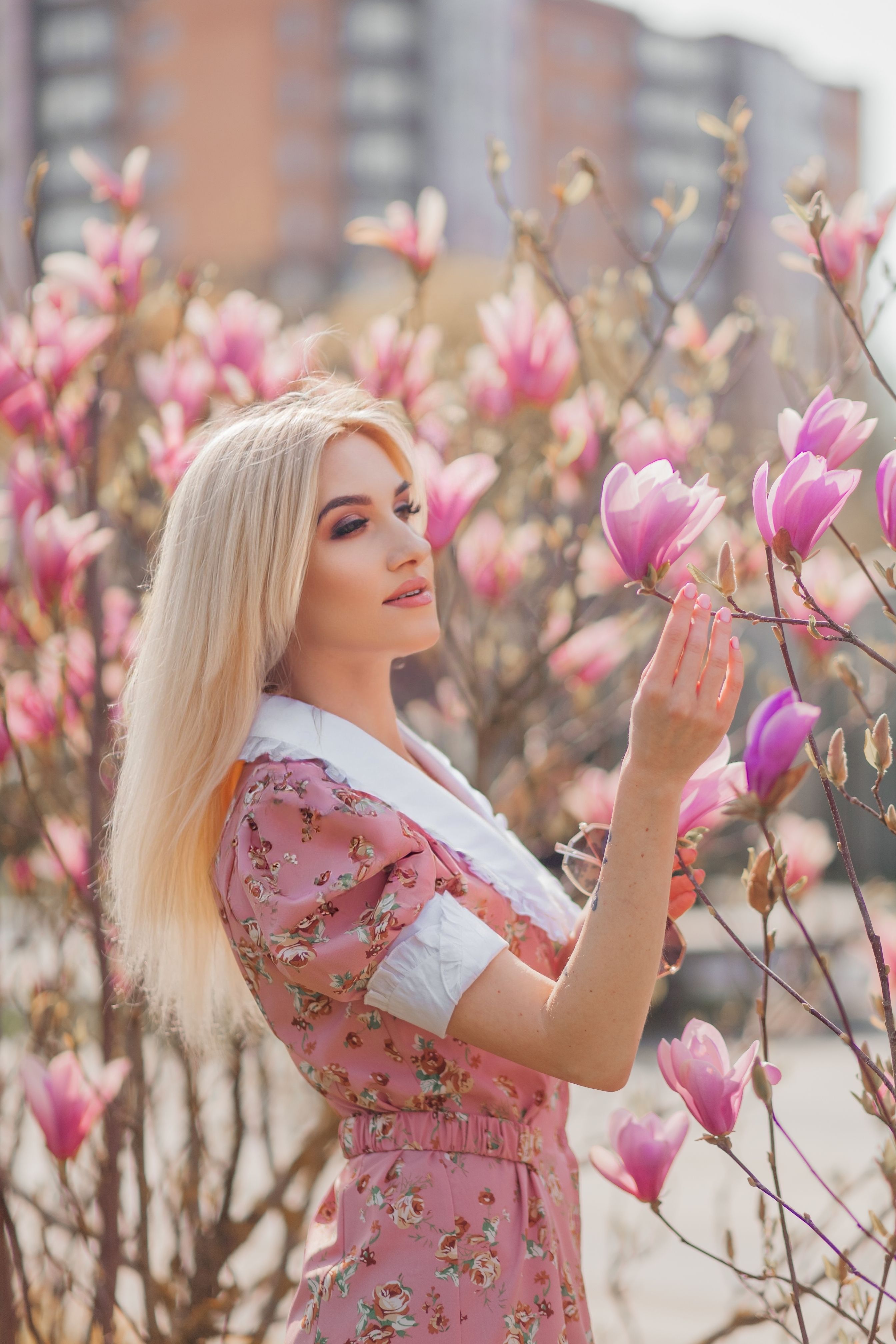 Woman in a Pink Dress Standing amid Flowers · Free Stock Photo