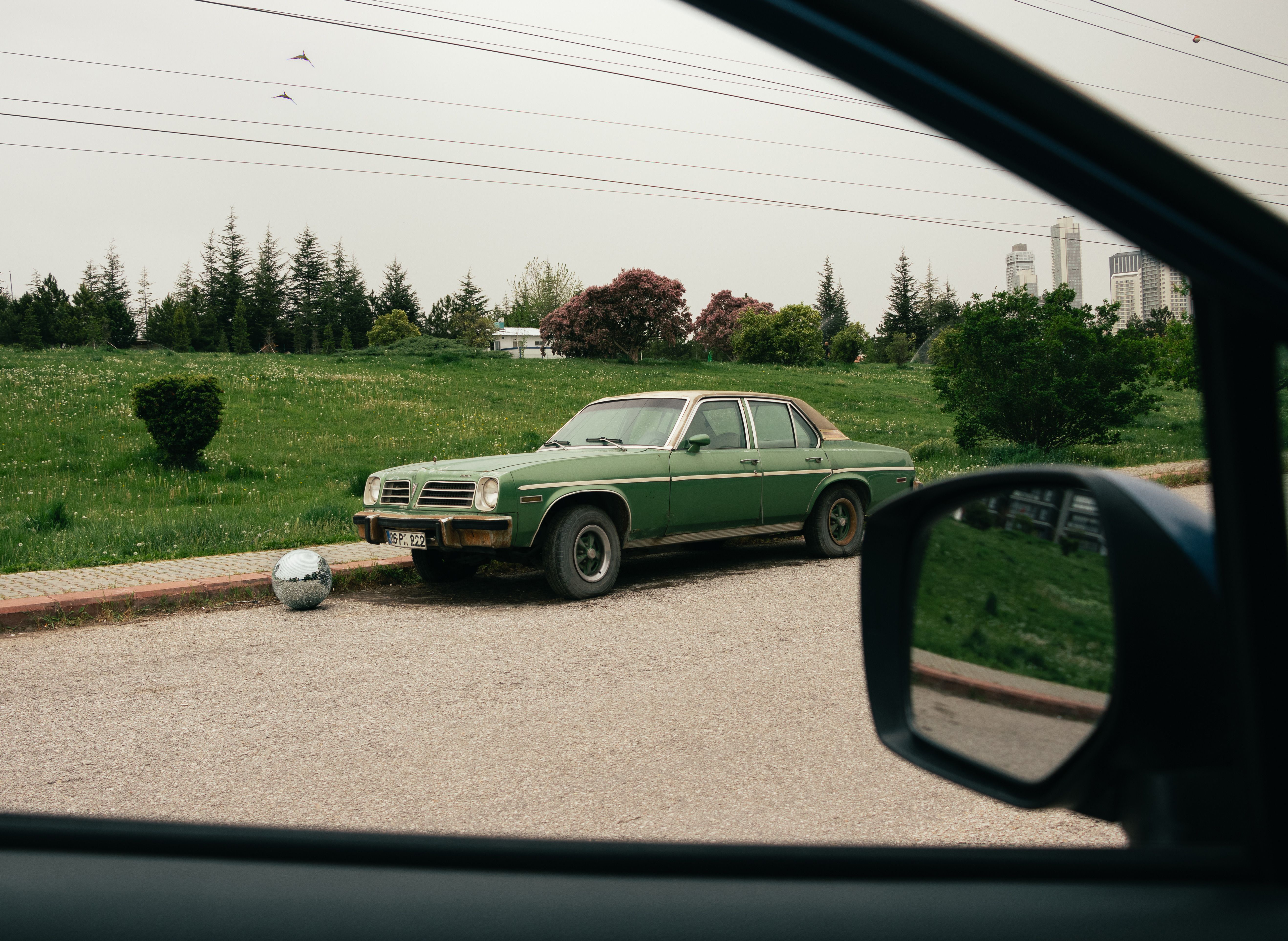 A car parked on the side of the road · Free Stock Photo