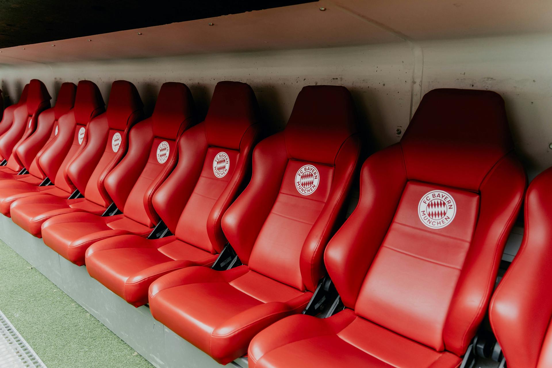 Red seats at Bayern Munich's Allianz Arena, showcasing iconic stadium design.