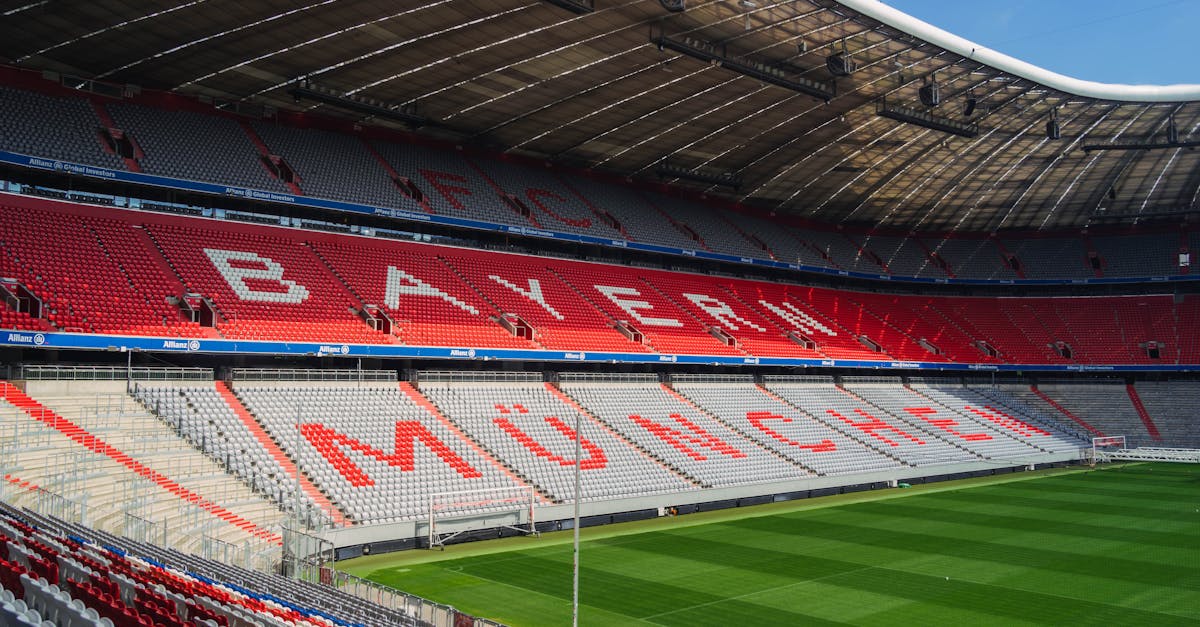 Explore the iconic Allianz Arena in Munich, home to FC Bayern, captured empty and sunlit.