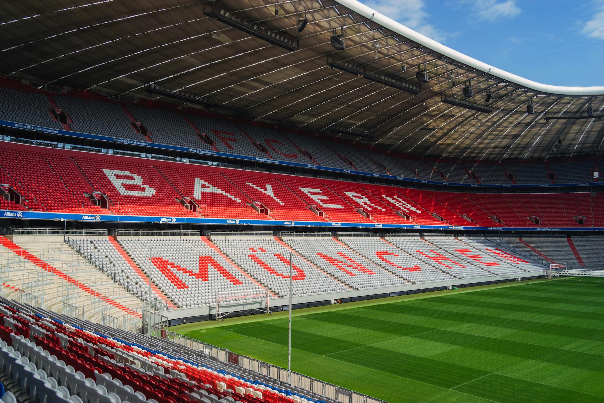 Explore the iconic Allianz Arena in Munich, home to FC Bayern, captured empty and sunlit.