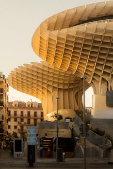An iconic view of Metropol Parasol in Seville, Spain showcasing modern architecture at sunset.