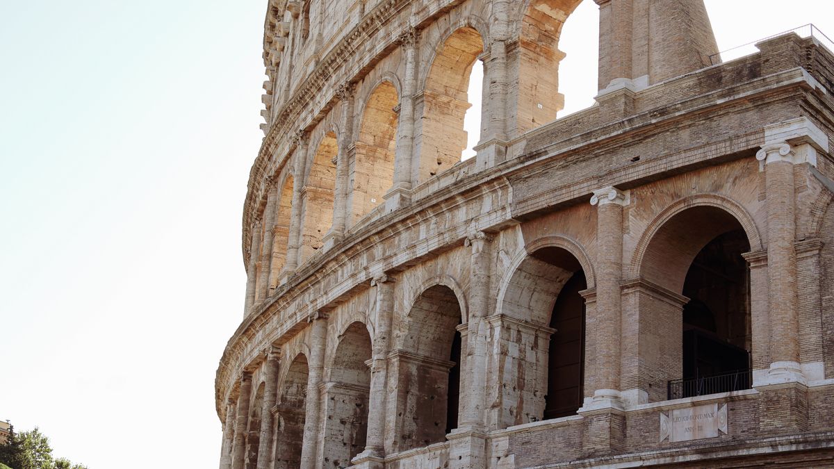 Close-up of the ancient Colosseum in Rome showcasing its majestic Roman architecture.
