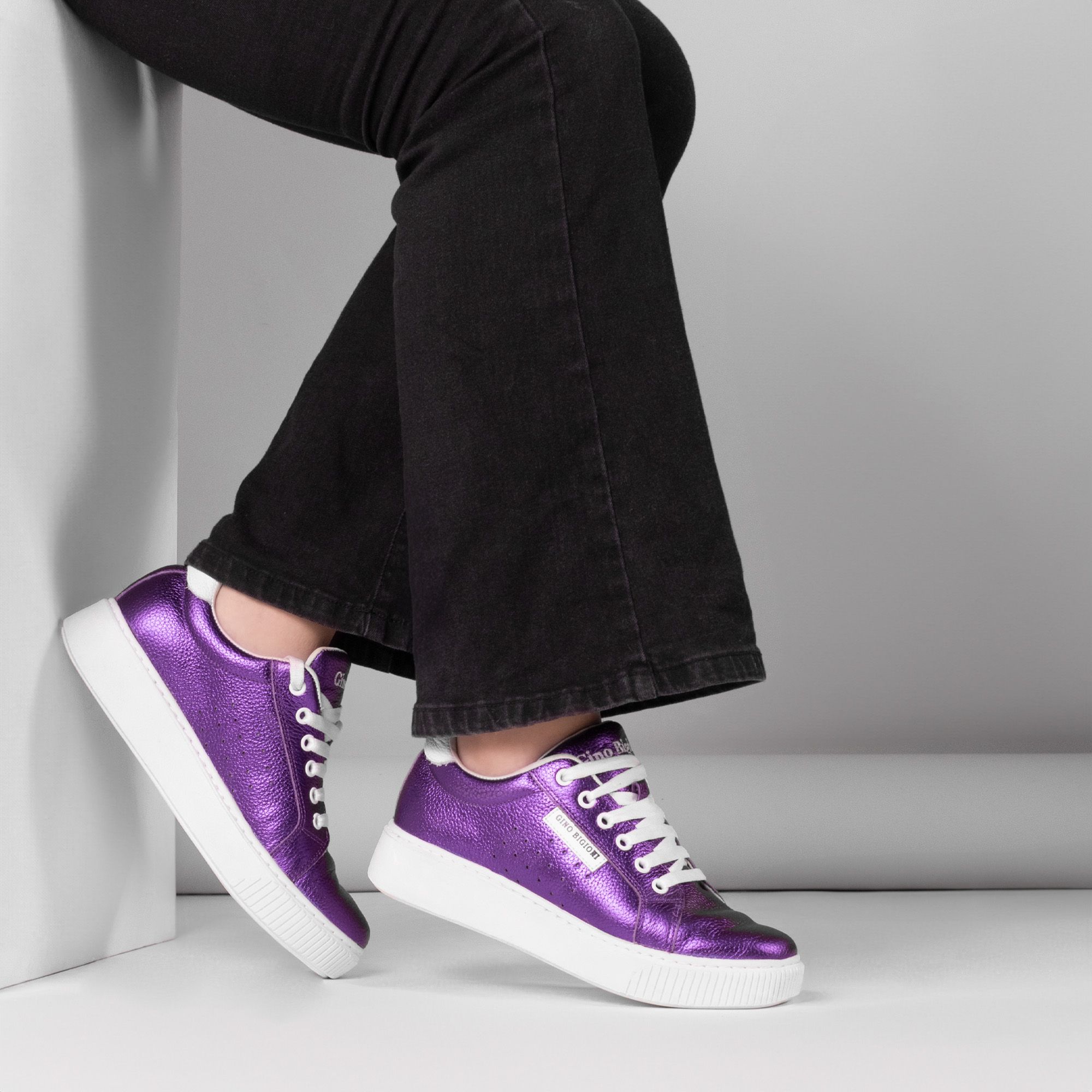 Product Shot of Purple Sneakers Worn by a Woman