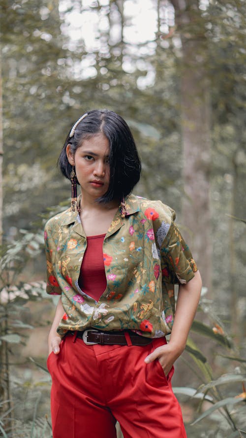 Lady Wearing Red and Green Floral Top And Red Pants