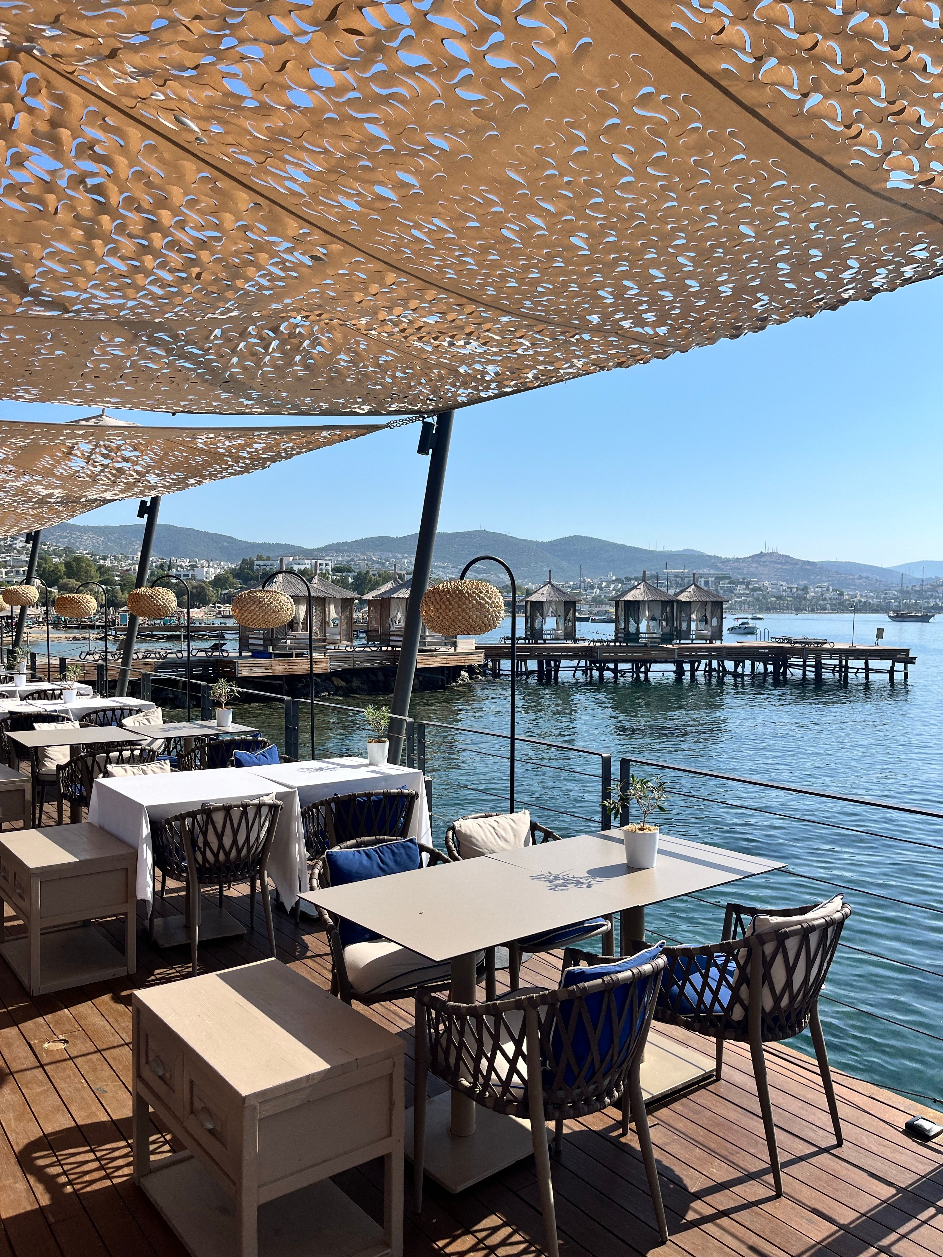 Restaurant Tables in a Harbor · Free Stock Photo