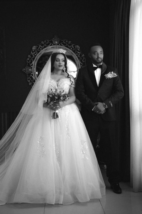 Free Timeless black and white portrait of a newlywed couple in formal attire, exuding classic elegance. Stock Photo