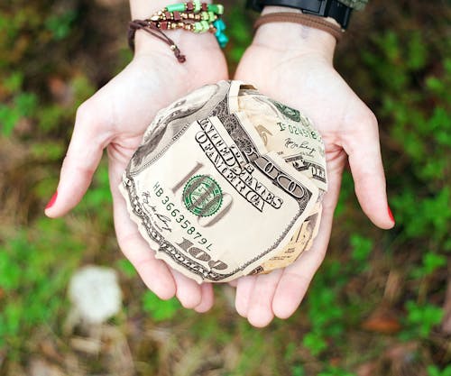 Free Person Holding U.s. Dollar Banknotes Stock Photo