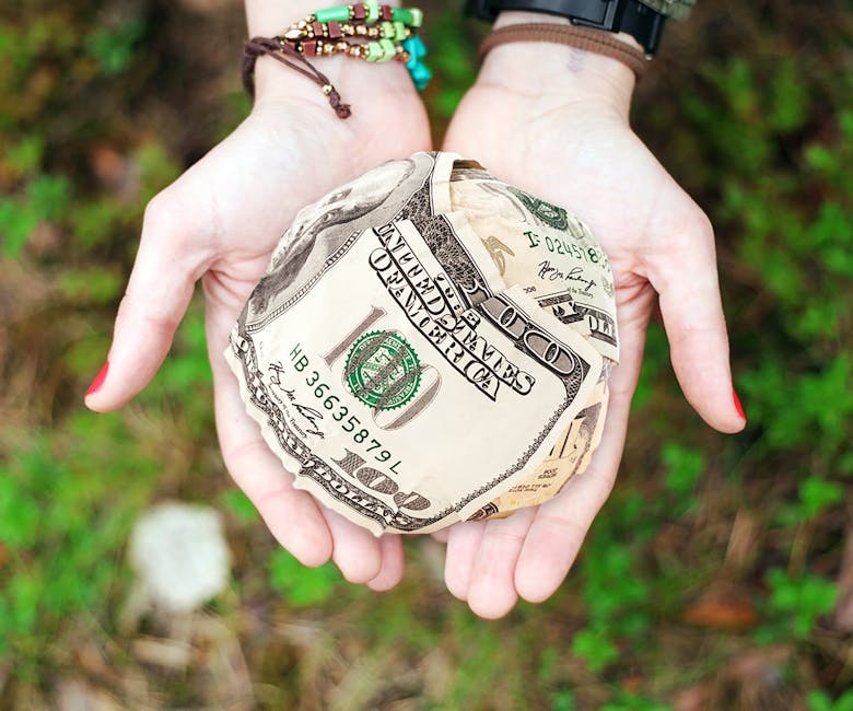 Person Holding U.s. Dollar Banknotes