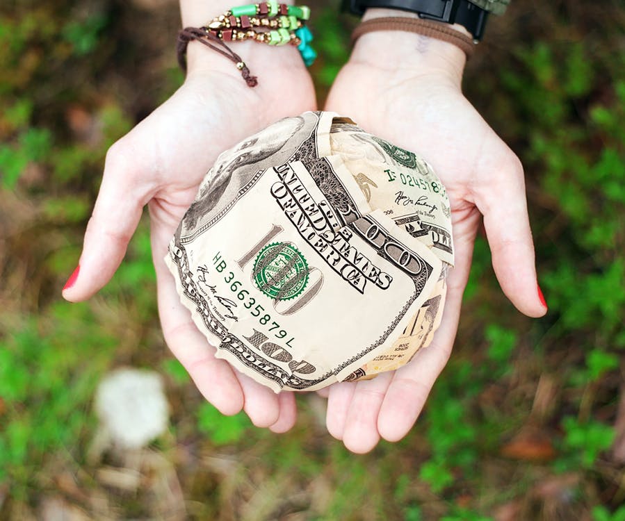 Free Person Holding U.s. Dollar Banknotes Stock Photo
