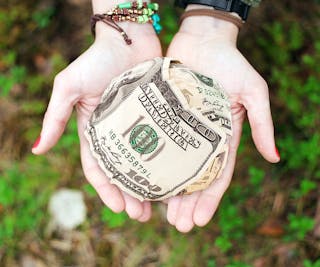 Person Holding U.s. Dollar Banknotes