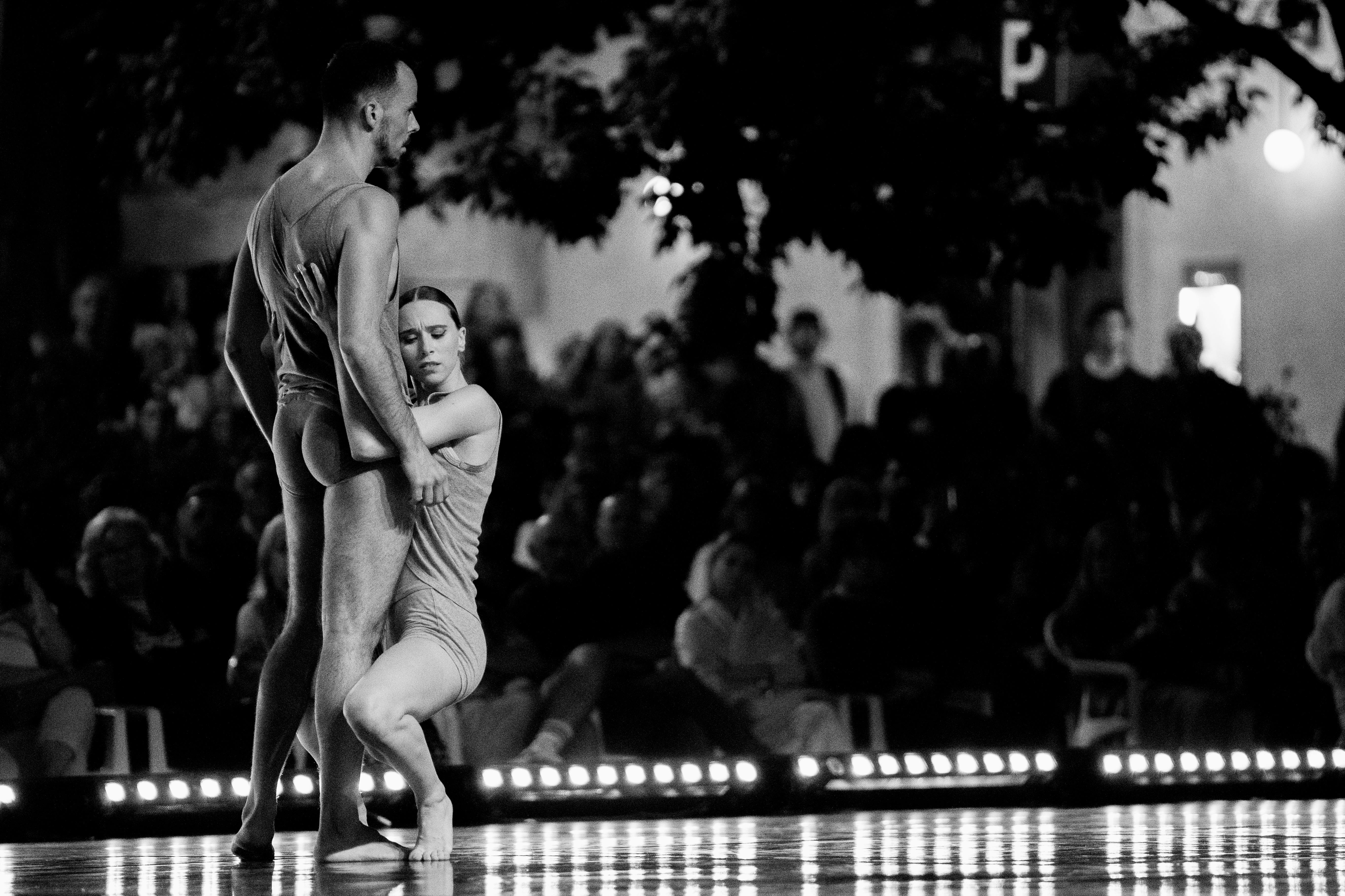 Free Elegant dance duo captured in black and white during a dramatic outdoor performance. Stock Photo