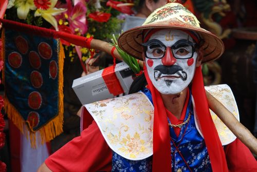 Free Colorful festival performer wearing traditional costume and stage makeup, showcasing cultural artistry. Stock Photo