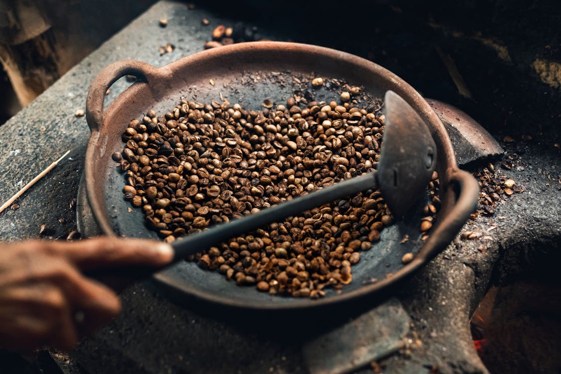 Free Coffee Beans on Round Wok Stock Photo