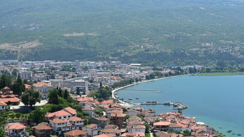 Free A stunning aerial view of Ohrid city by the lake, showcasing beautiful architecture and nature. Stock Photo