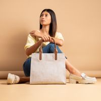 Studio shot of a beige handbag — photo by José Martin Segura Benites on Pexels