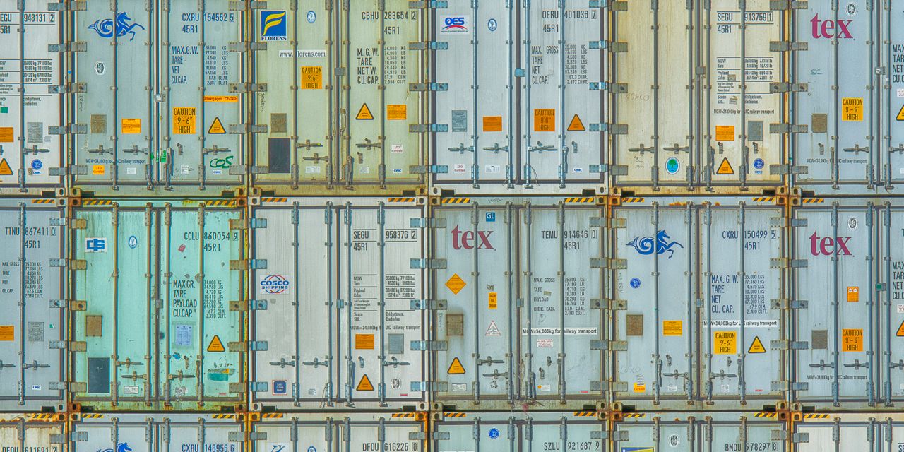 A vibrant display of stacked shipping containers, highlighting industrial organization.