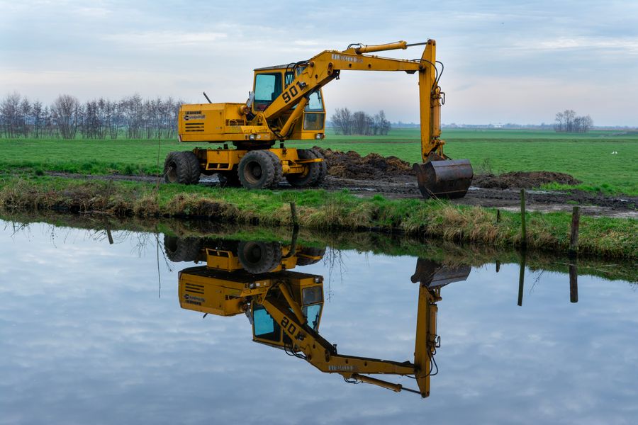 Outdoor construction site with excavated soil and equipment