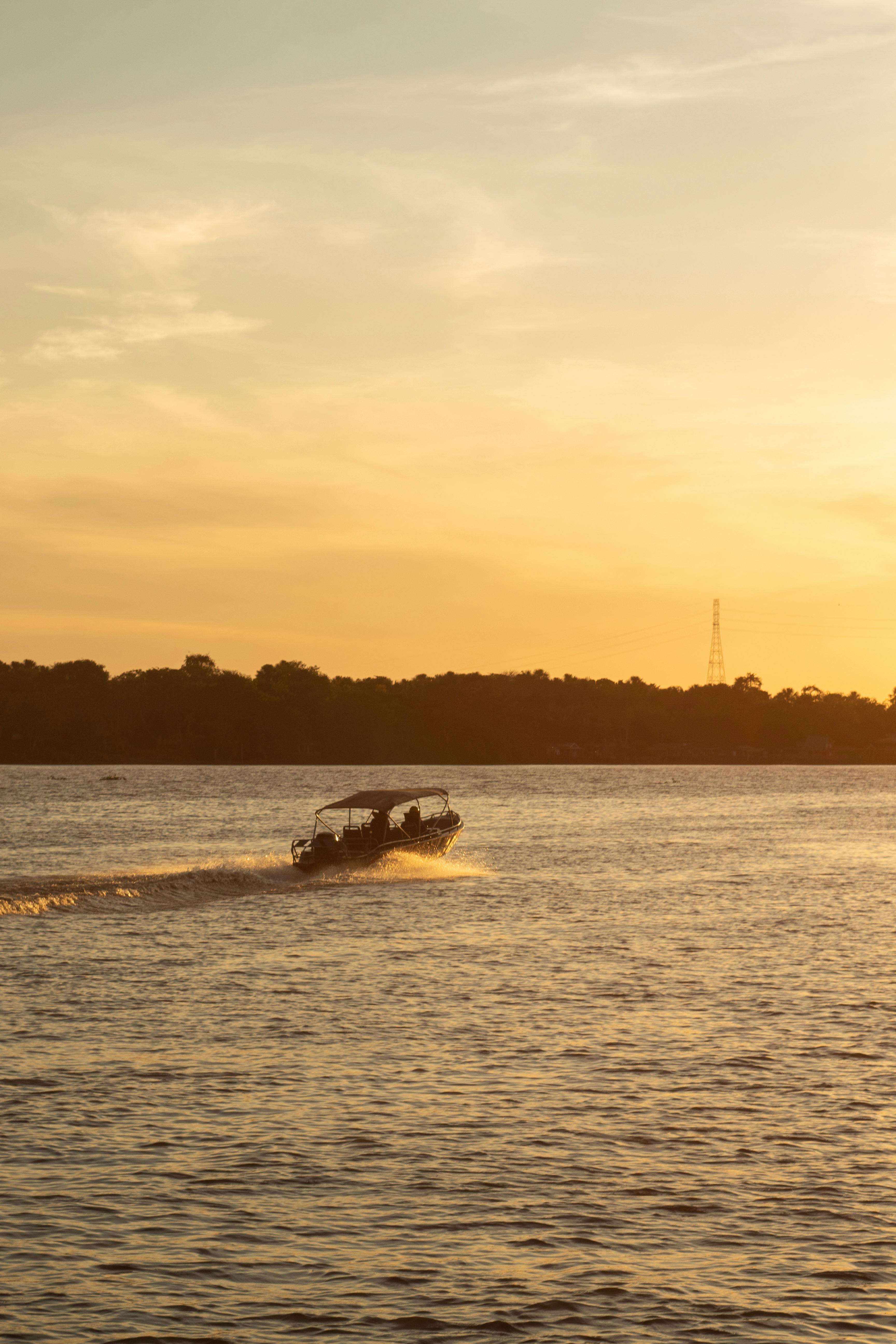 motorboat on the river at sunset