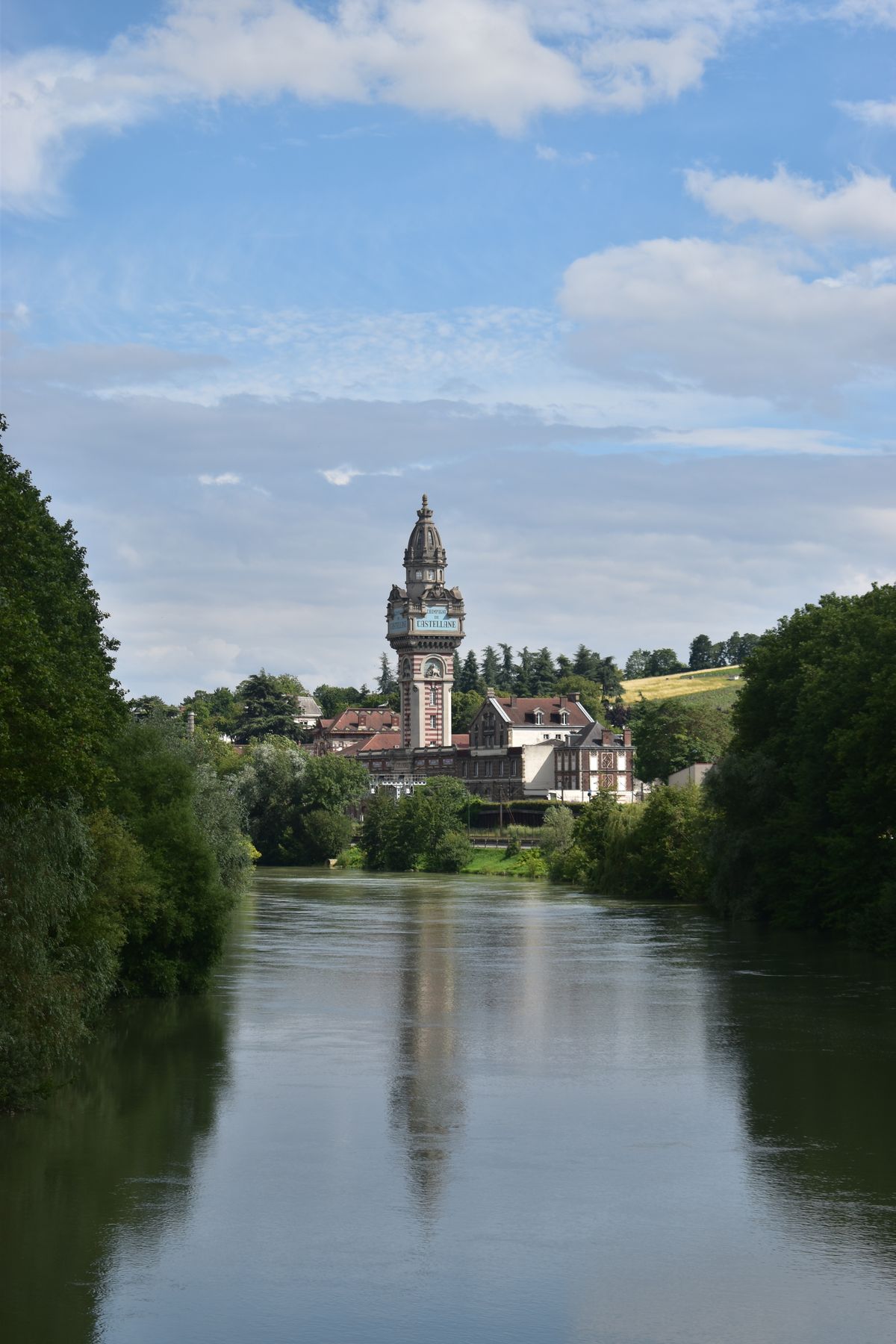 An ornate Champagne-house tower rising above Épernay on the Marne
