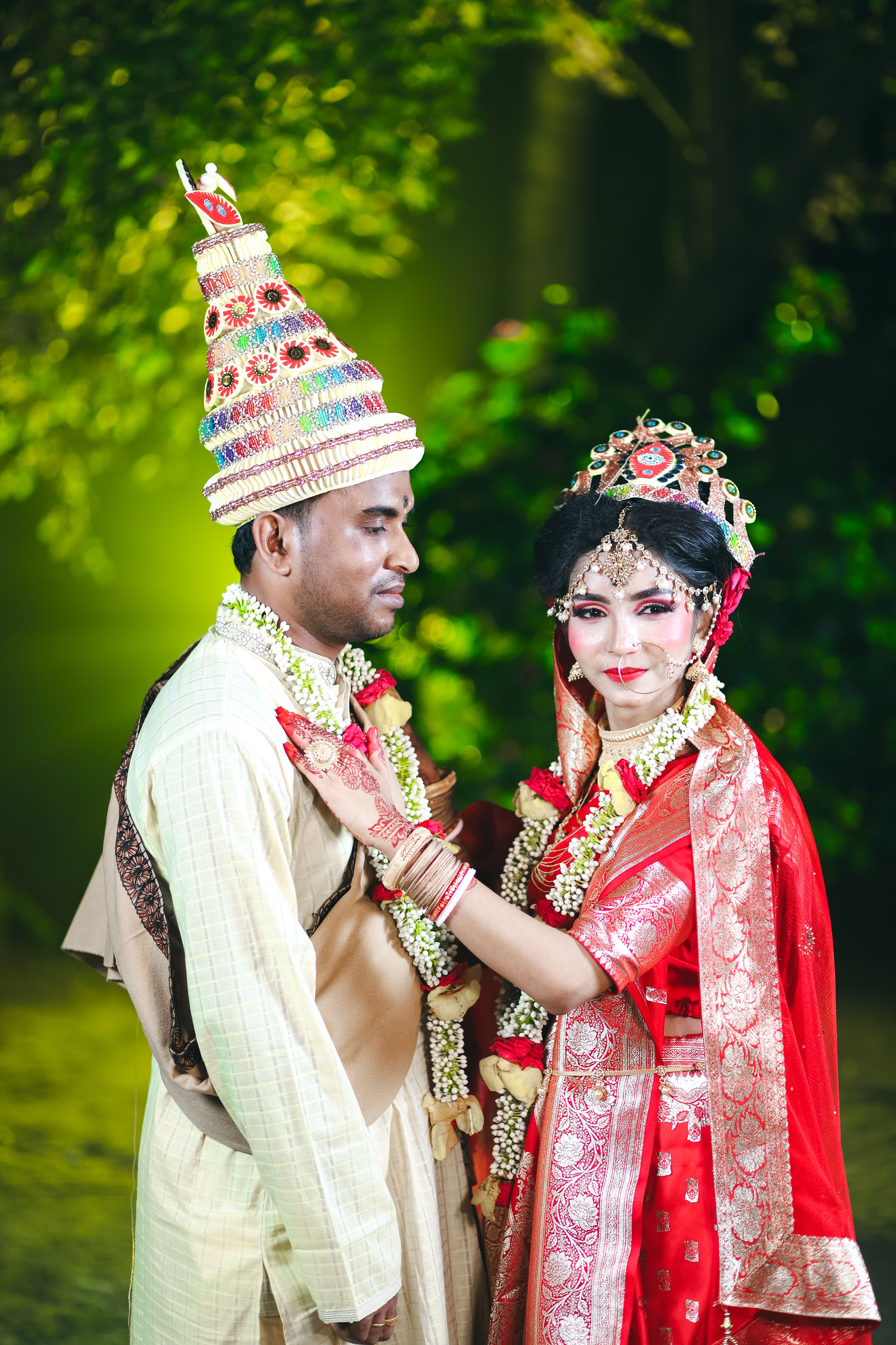 A couple in traditional indian attire posing for a photo · Free Stock Photo