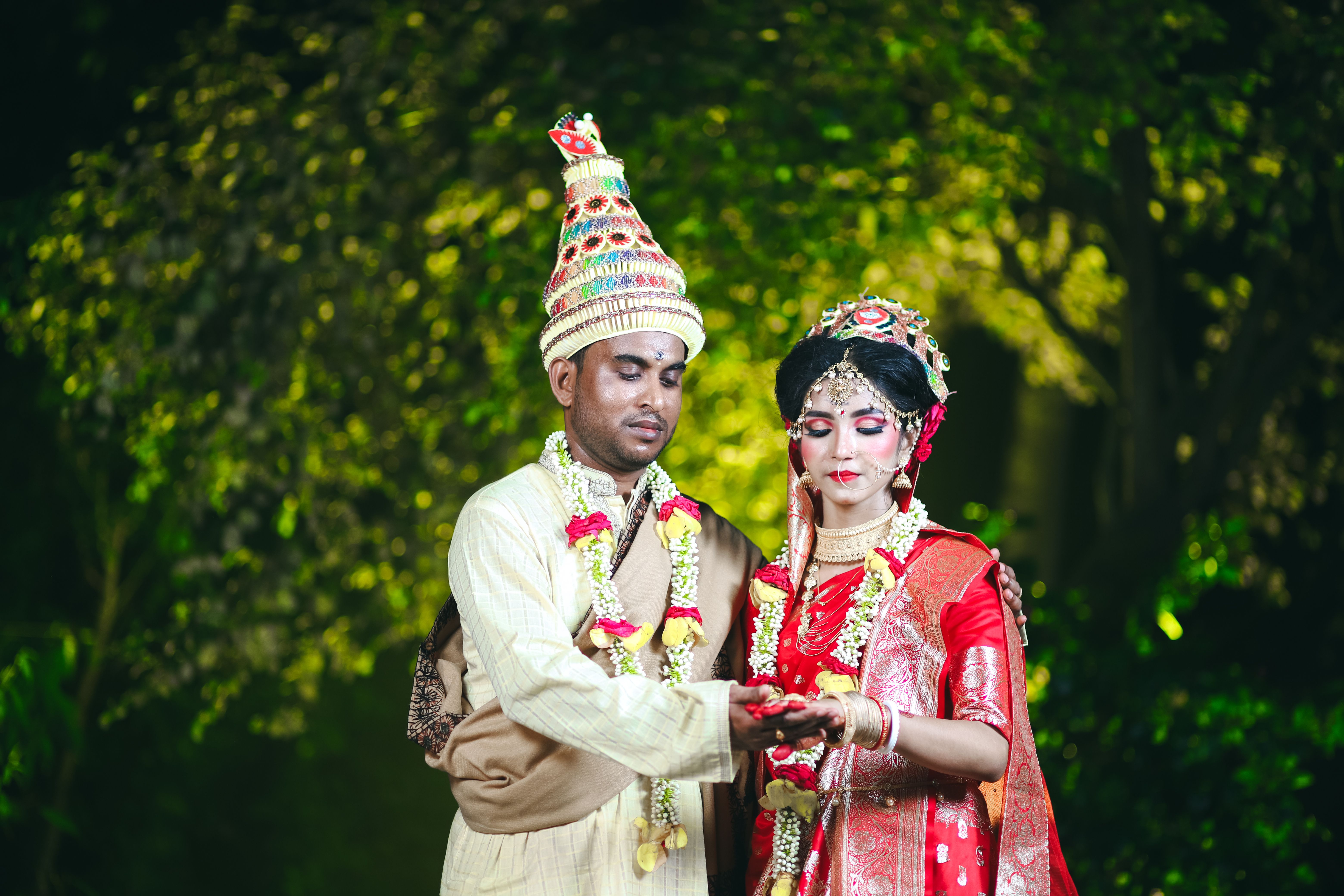 A couple in traditional indian attire pose for a photo · Free Stock Photo