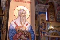 Vibrant religious artwork displayed inside a cathedral, highlighting spiritual themes and cultural artistry.