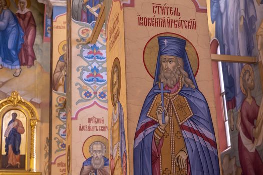 Intricate Orthodox church murals depicting saints and religious icons in vibrant colors.