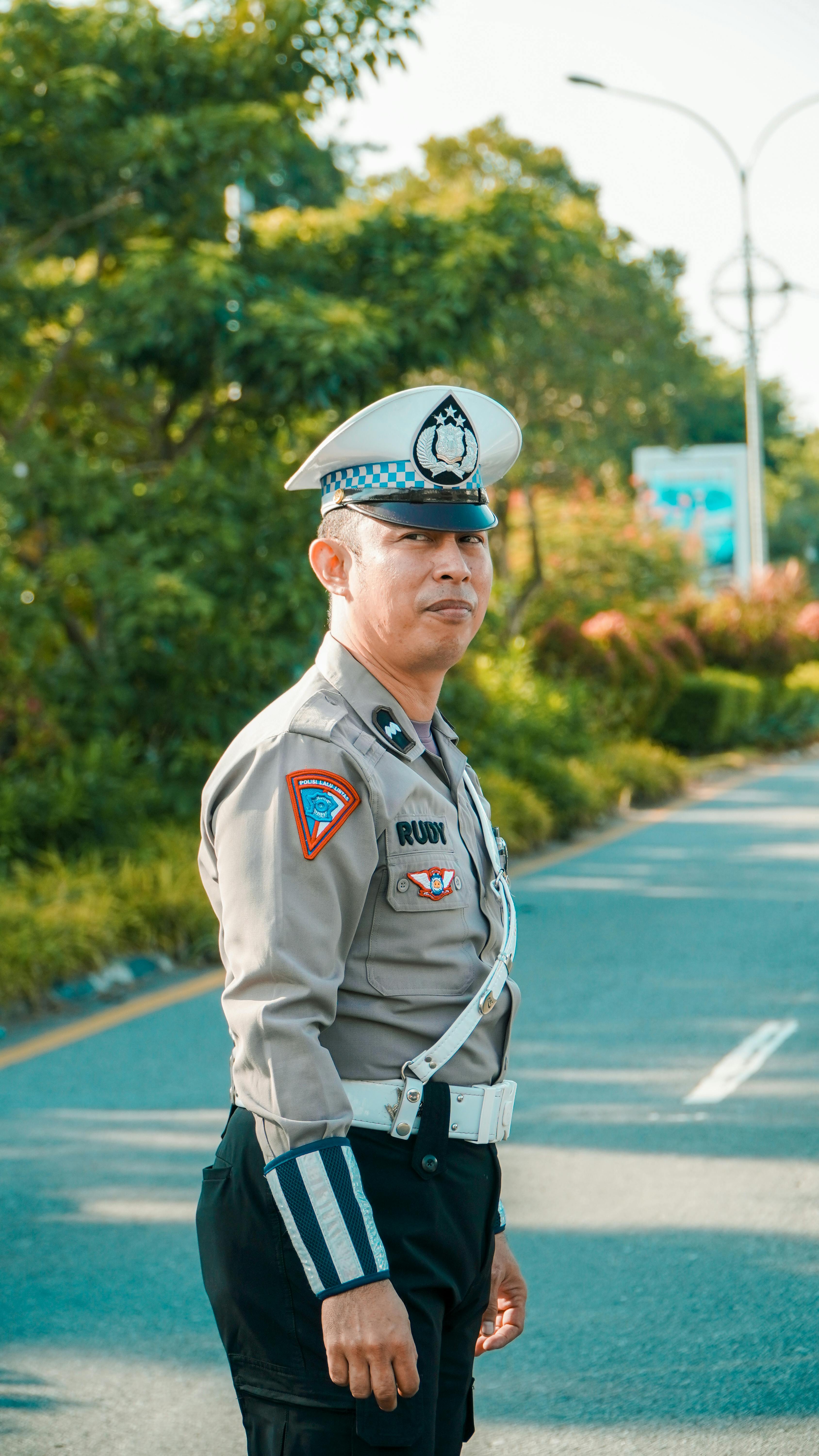 policeman in uniform on road