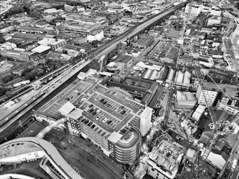 Black and white aerial view of Birmingham cityscape showcasing urban architecture and infrastructure.