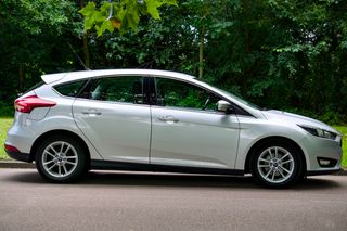 Silver hatchback in side profile, photo by Mike Bird on Pexels