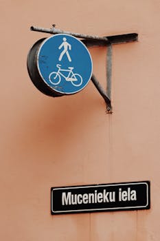 Blue pedestrian and bicycle sign on Mucenieku iela, Riga, Latvia's old town.