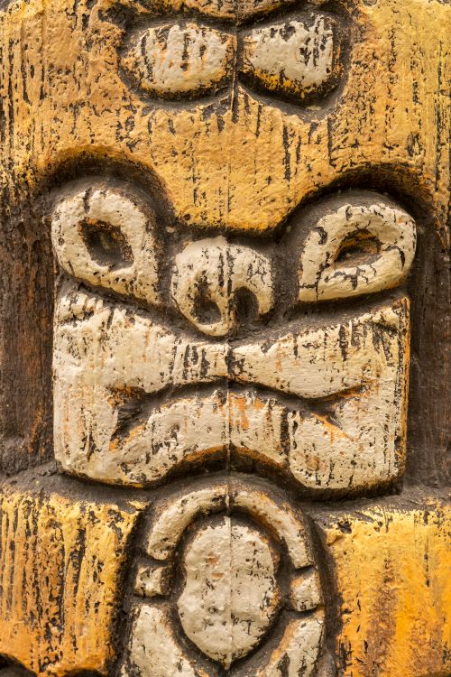 Free Close-up of an ancient ornate stone sculpture highlighting intricate details and cultural artistry. Stock Photo
