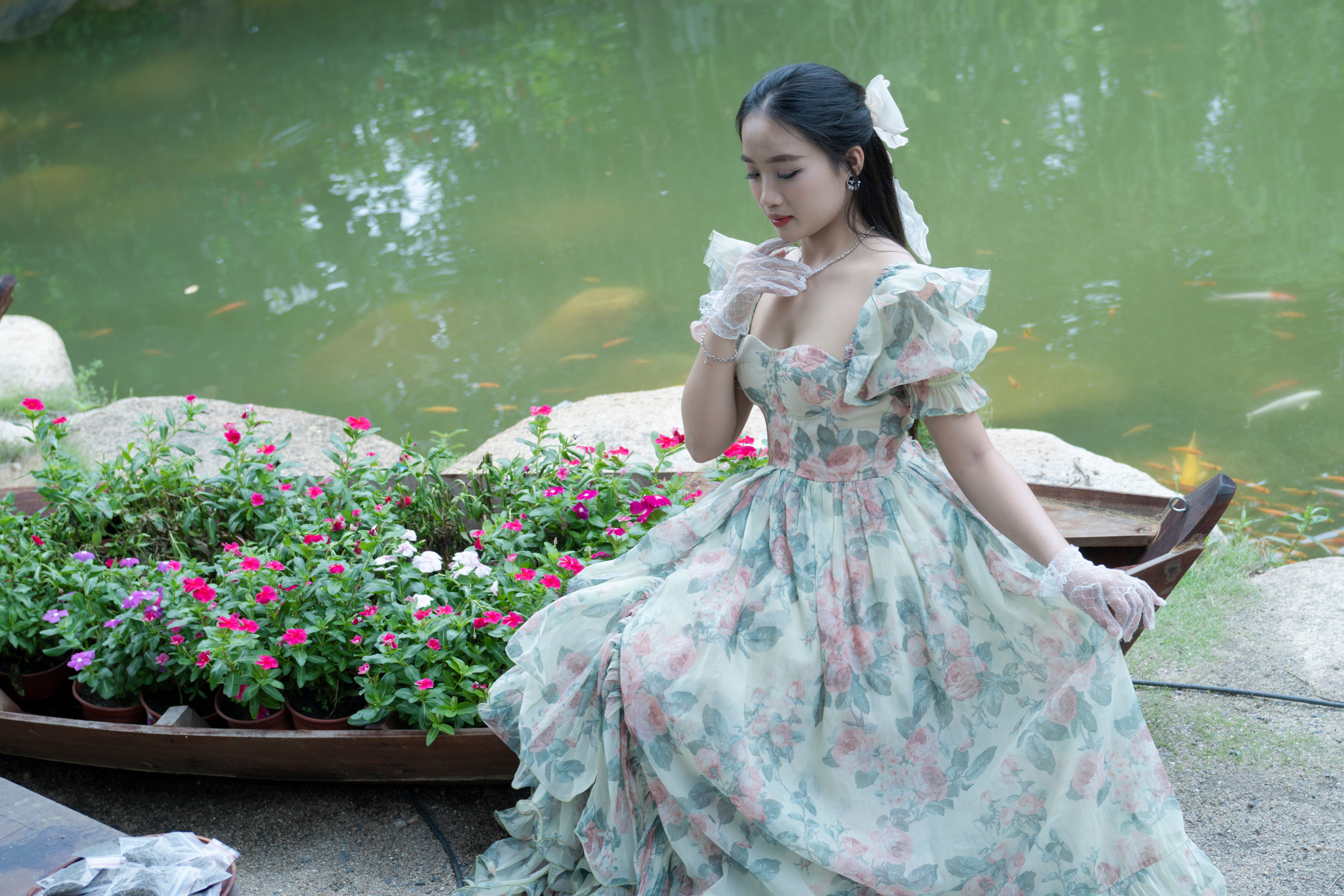 A Woman in a Dress by a Pond · Free Stock Photo