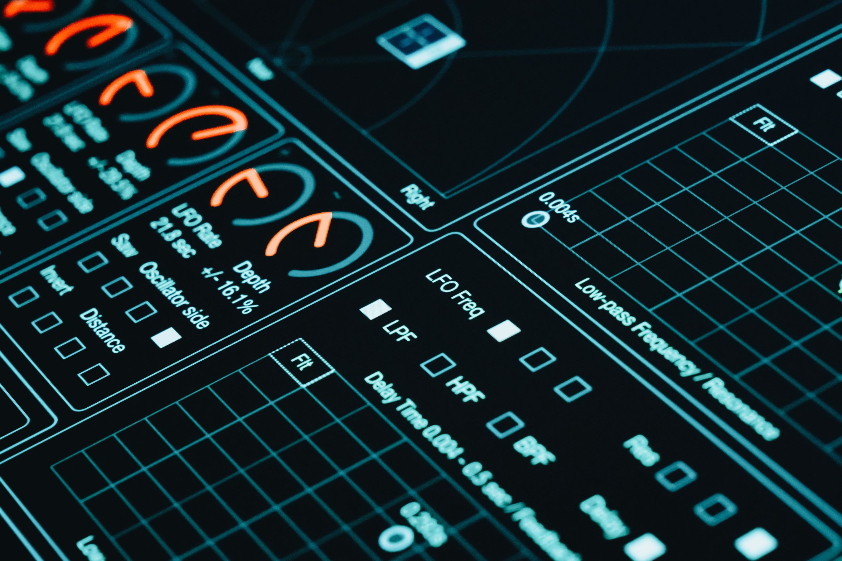 Close-up of futuristic graphs and data analytics in low light