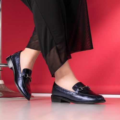 Free Stylish blue loafers and sheer black pants in a vibrant setting. Stock Photo