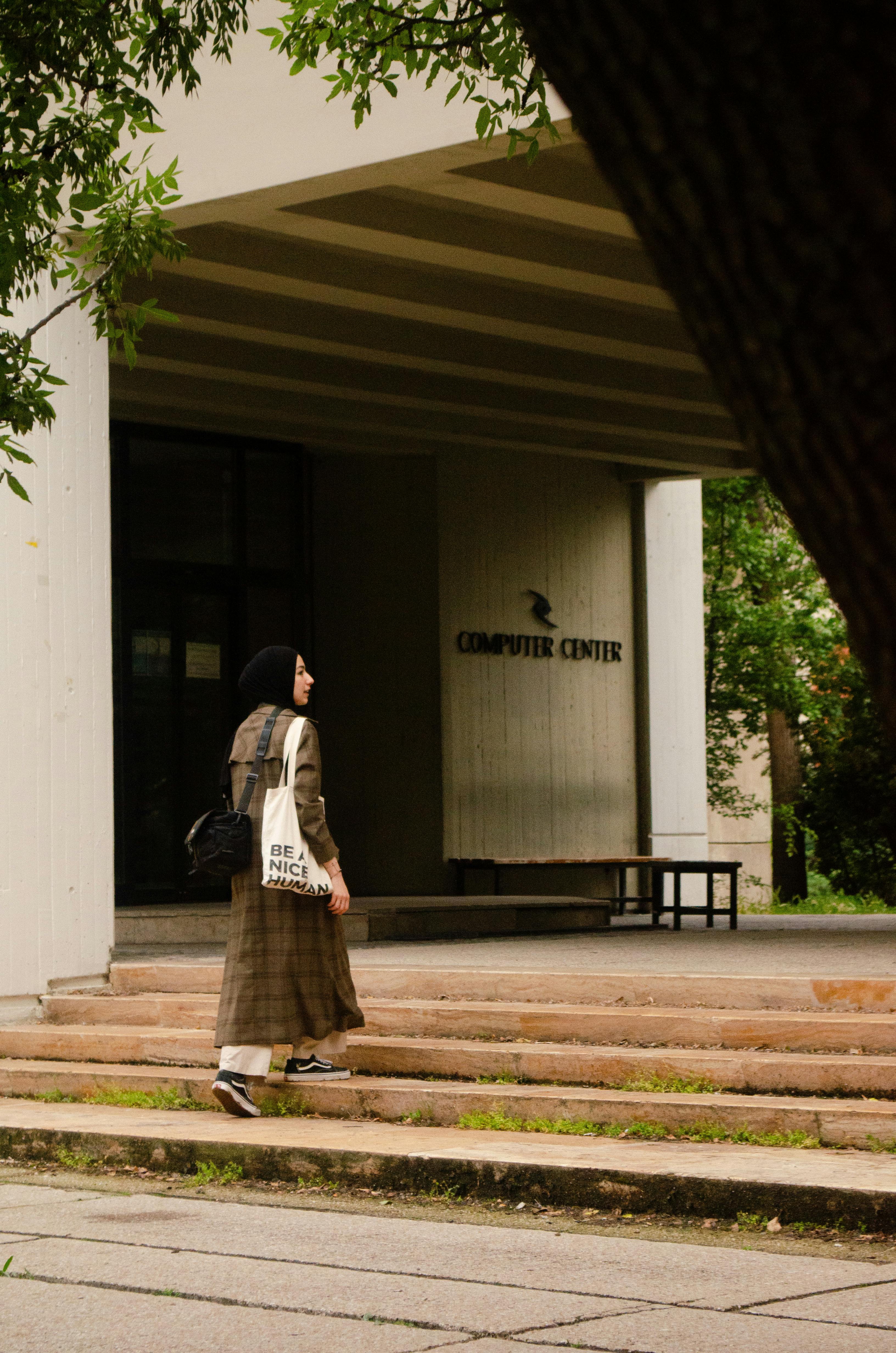 woman walking in coat and with bags