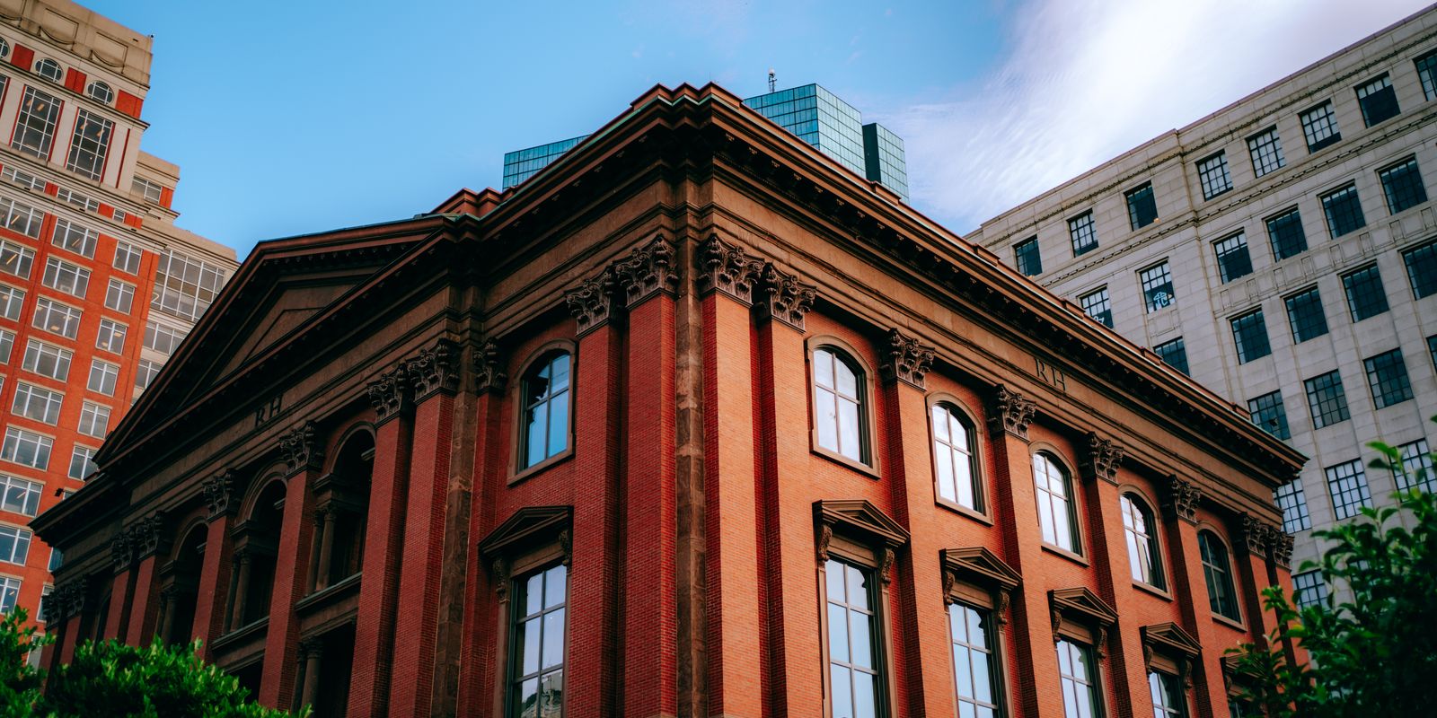 A historic red-brick building in a downtown streetscape