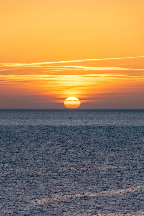 Free A breathtaking sunset view over the ocean in Ciudadela, showcasing vibrant colors and serene waters. Stock Photo