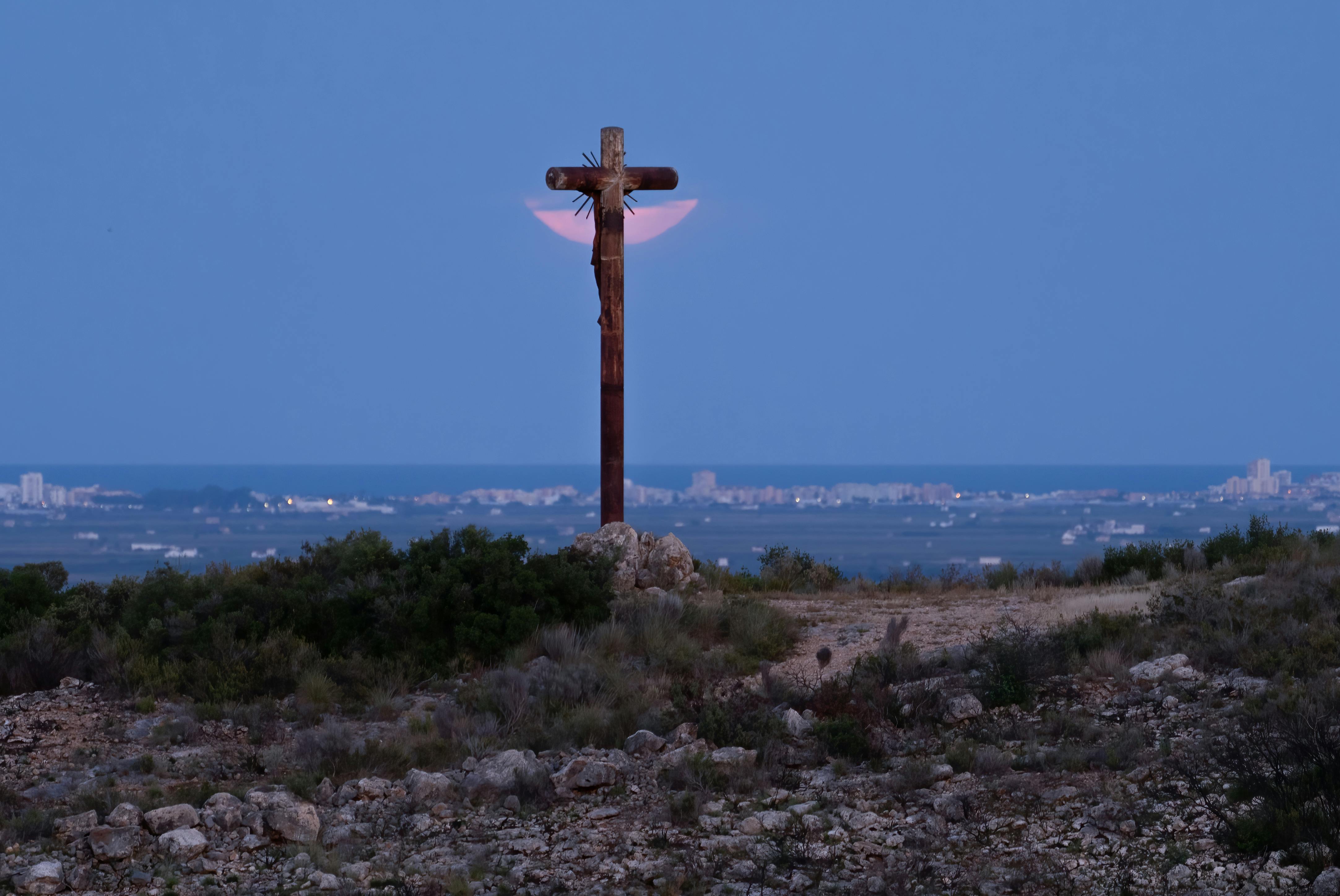 a cross on a hill