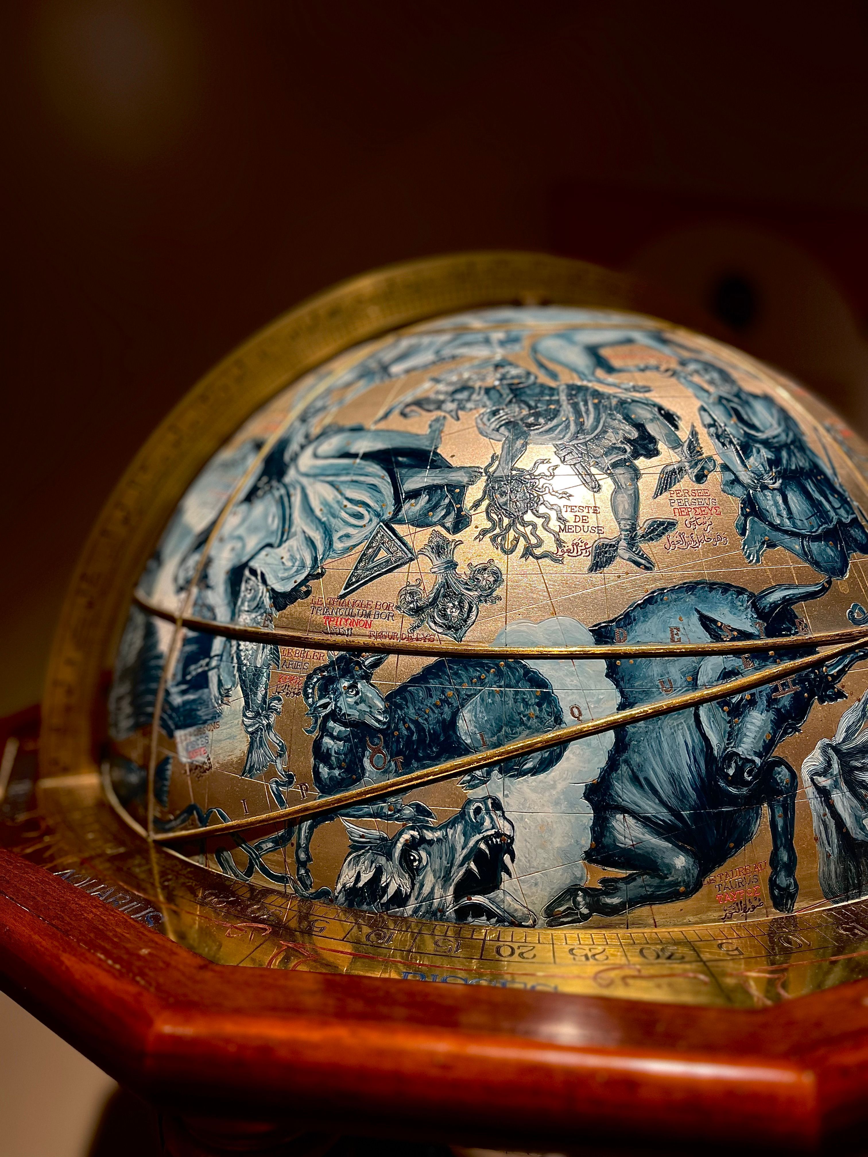 Close-up of a vintage celestial globe illustrating constellations, located in a museum in İstanbul.