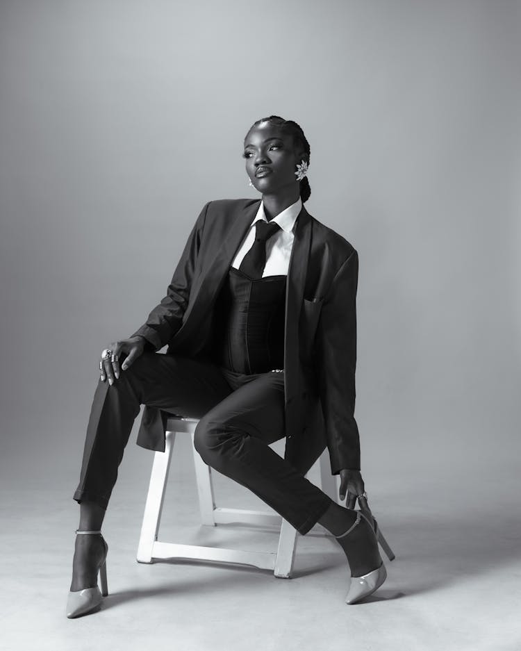 Model Wearing Heels To Suit And Necktie