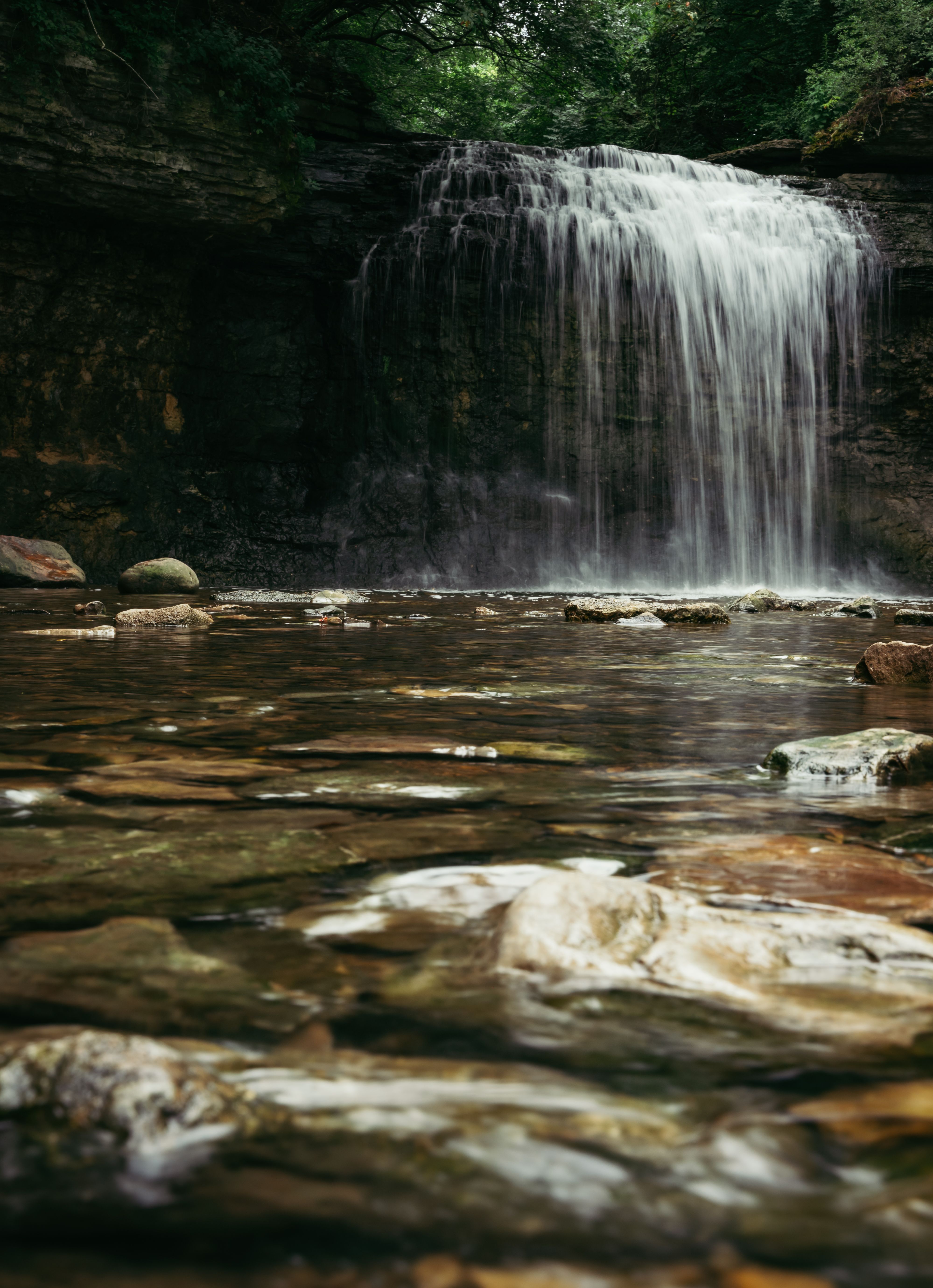Waterfall behind Rocks · Free Stock Photo