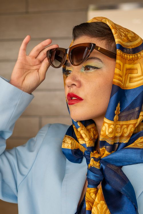 A Woman Wearing Sunglasses And A Scarf Free Stock Photo a-woman-wearing-sunglasses-and-a-scarf-free-stock-photo