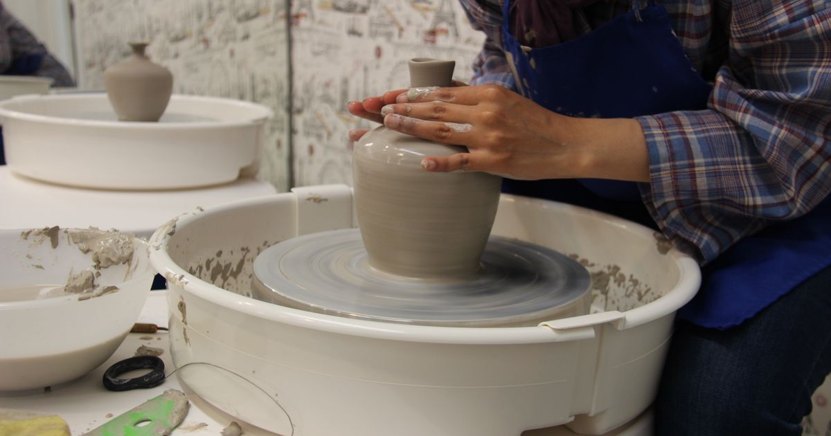 Potter's hands working with clay