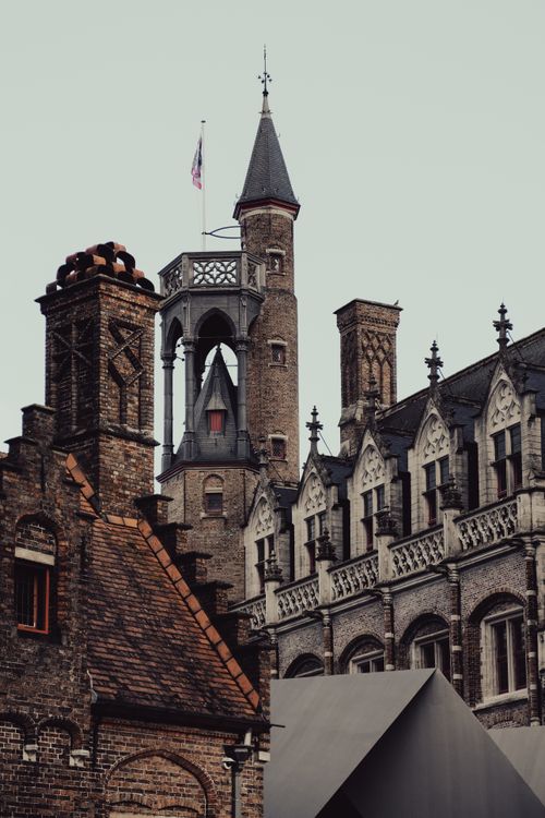 Free Explore the gothic architectural charm of Brugge with its iconic medieval buildings and towers. Stock Photo