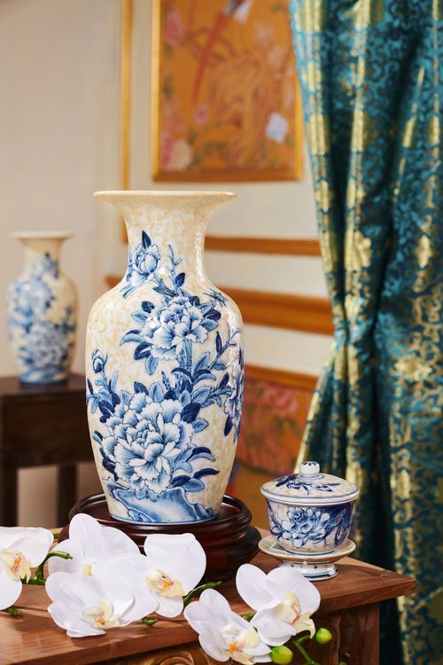 Free Stylish blue and white porcelain vase with floral motifs in an interior setting. Stock Photo