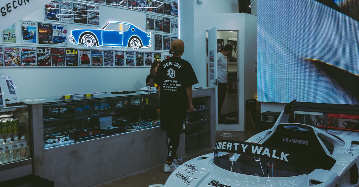 1 Person Rally Small One Person Rally Car in Workshop Reception · Free Stock Photo