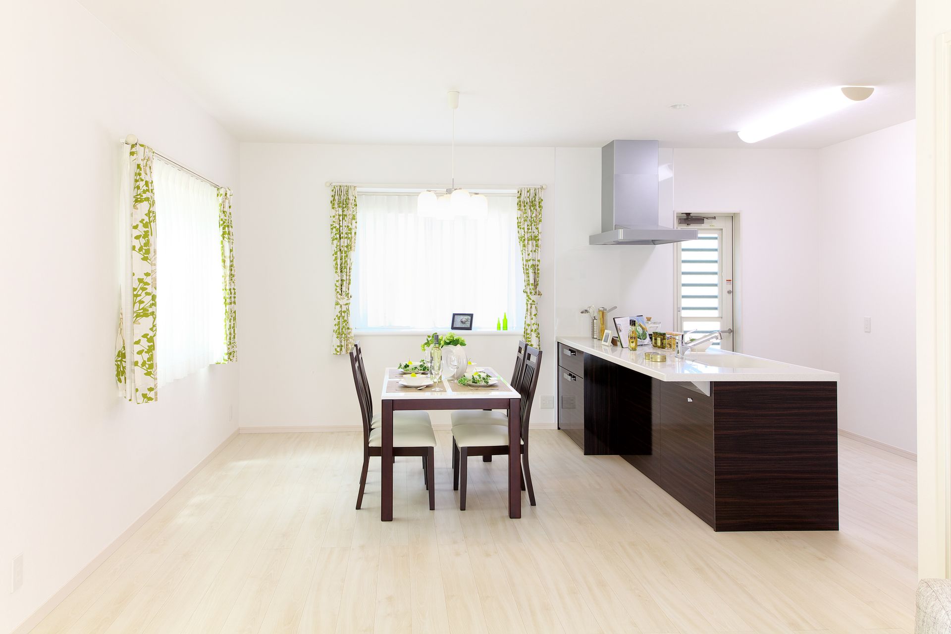 Rectangular White and Brown Wooden Dining Table and Four Chairs Near White and Brown Wooden Pedestal Desk