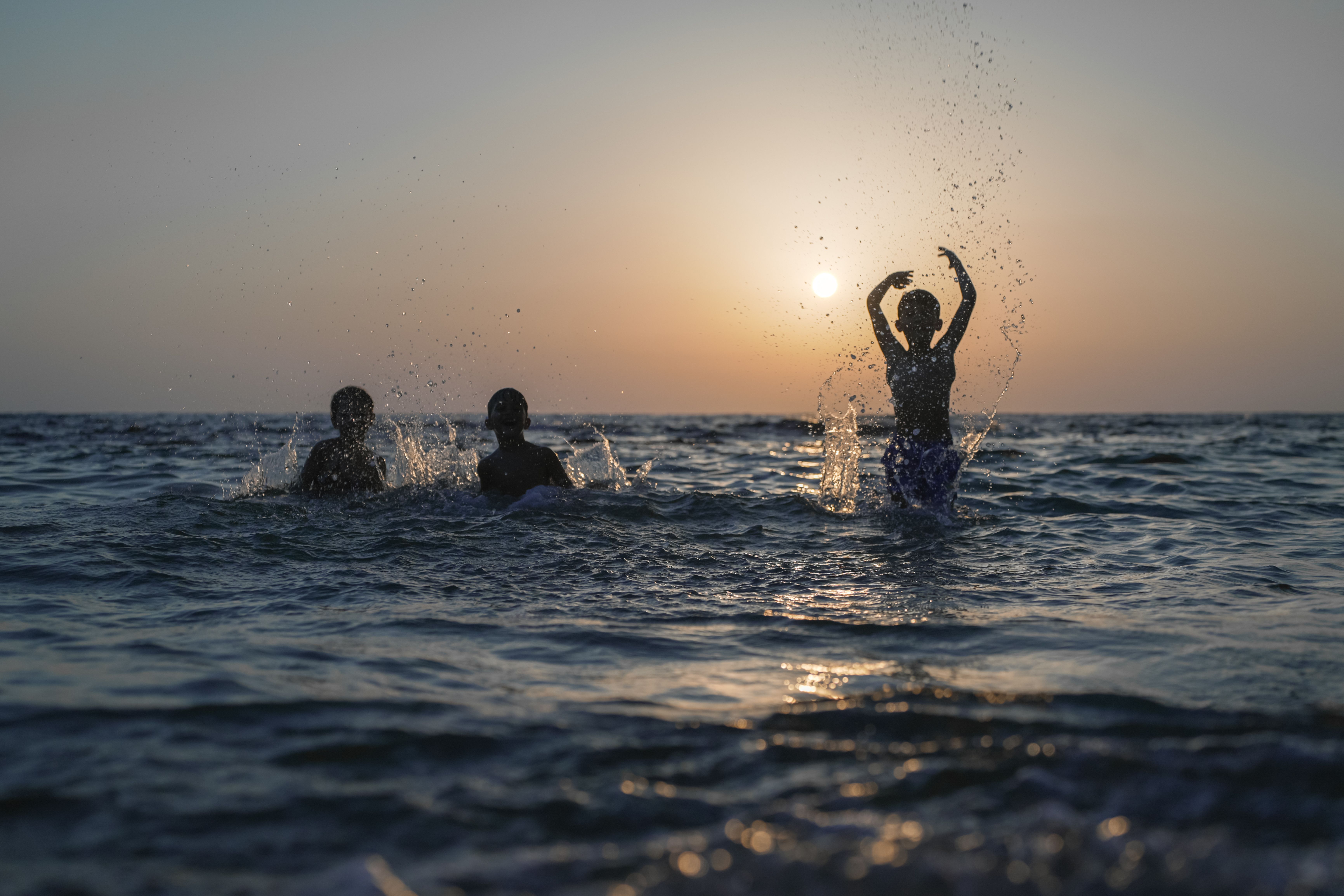Kids Playing at the Beach · Free Stock Photo